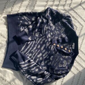 Navy blue sweater with almost cheetah like blue and black  prints